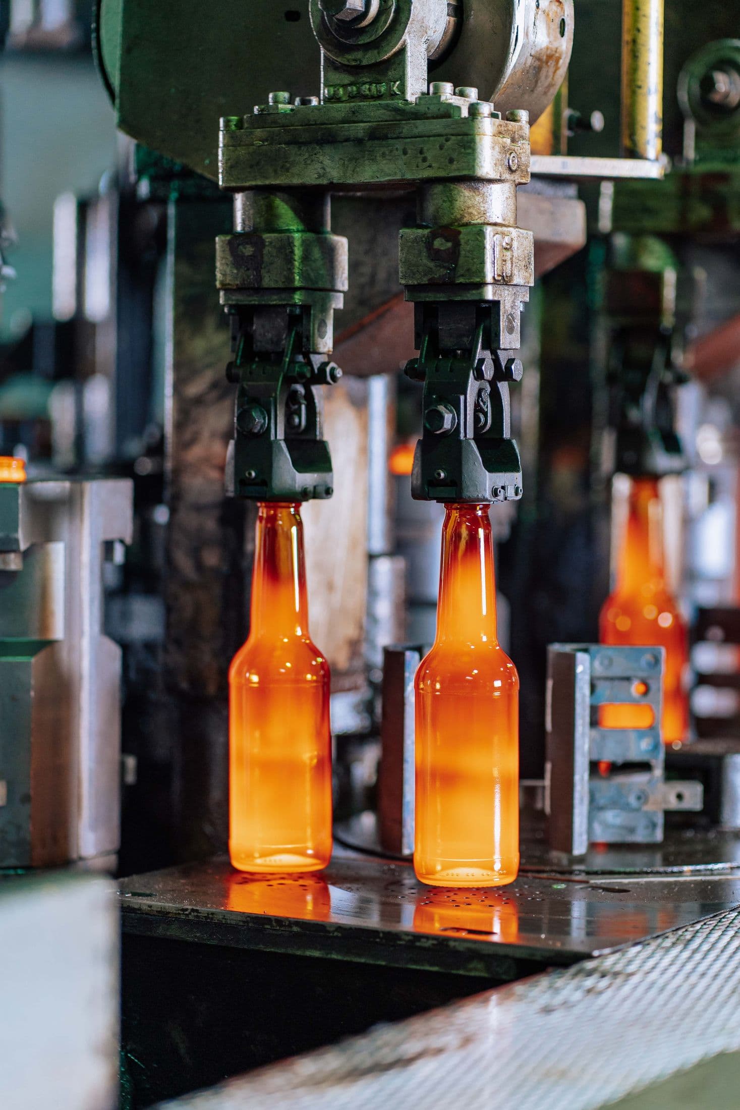 Hot glass bottles on a forming machine