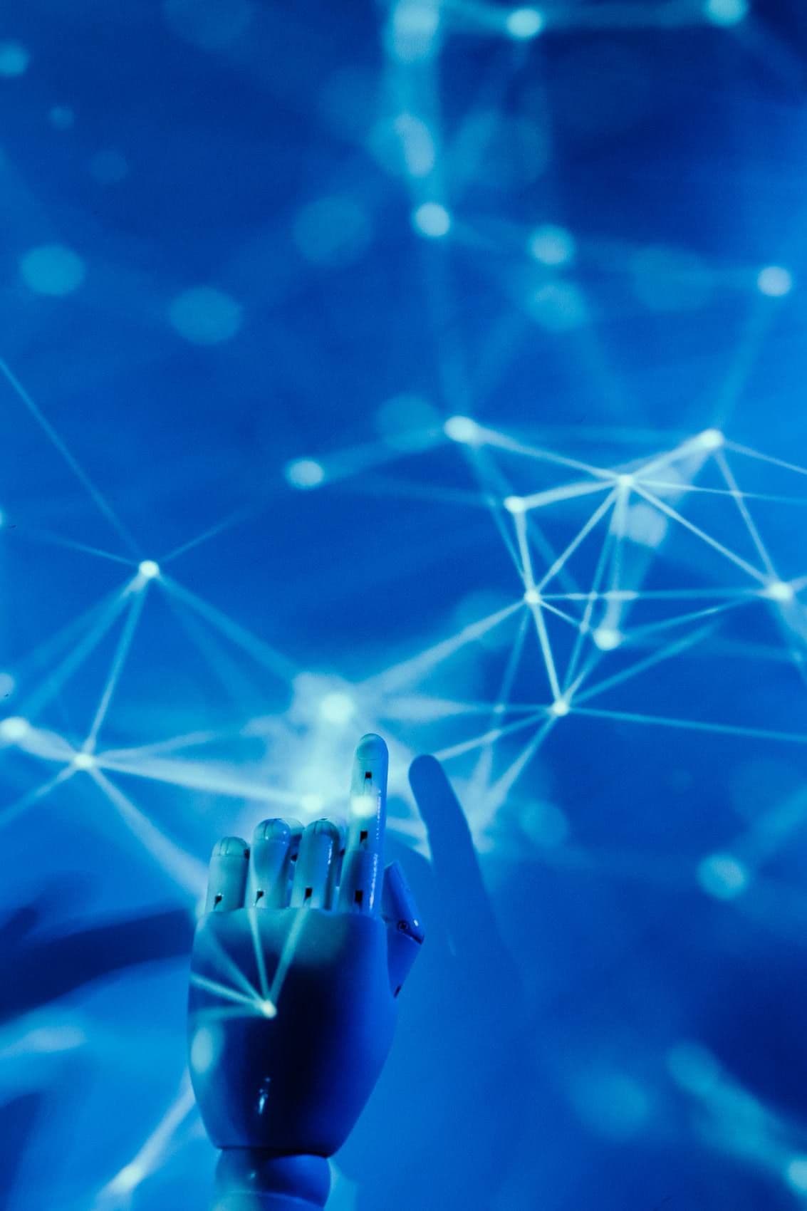 Robotic hand reaching into a networked data graph
