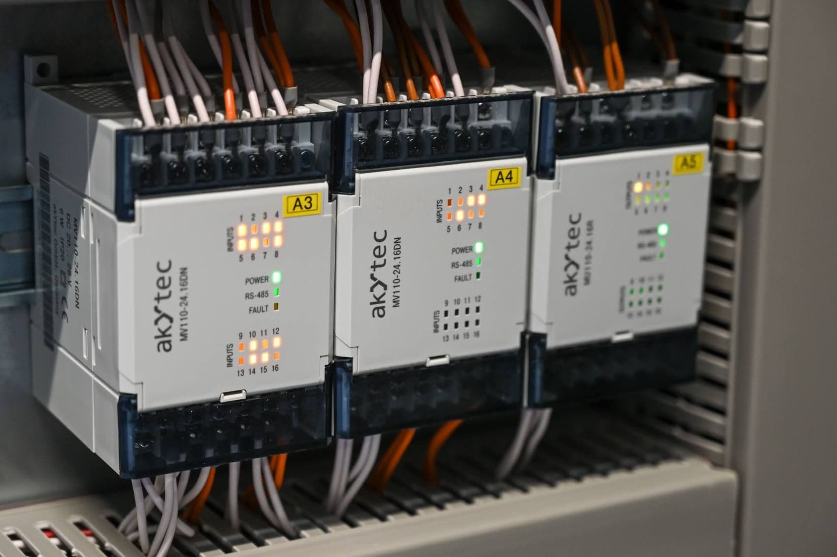 PLC input and output modules wired in a control cabinet